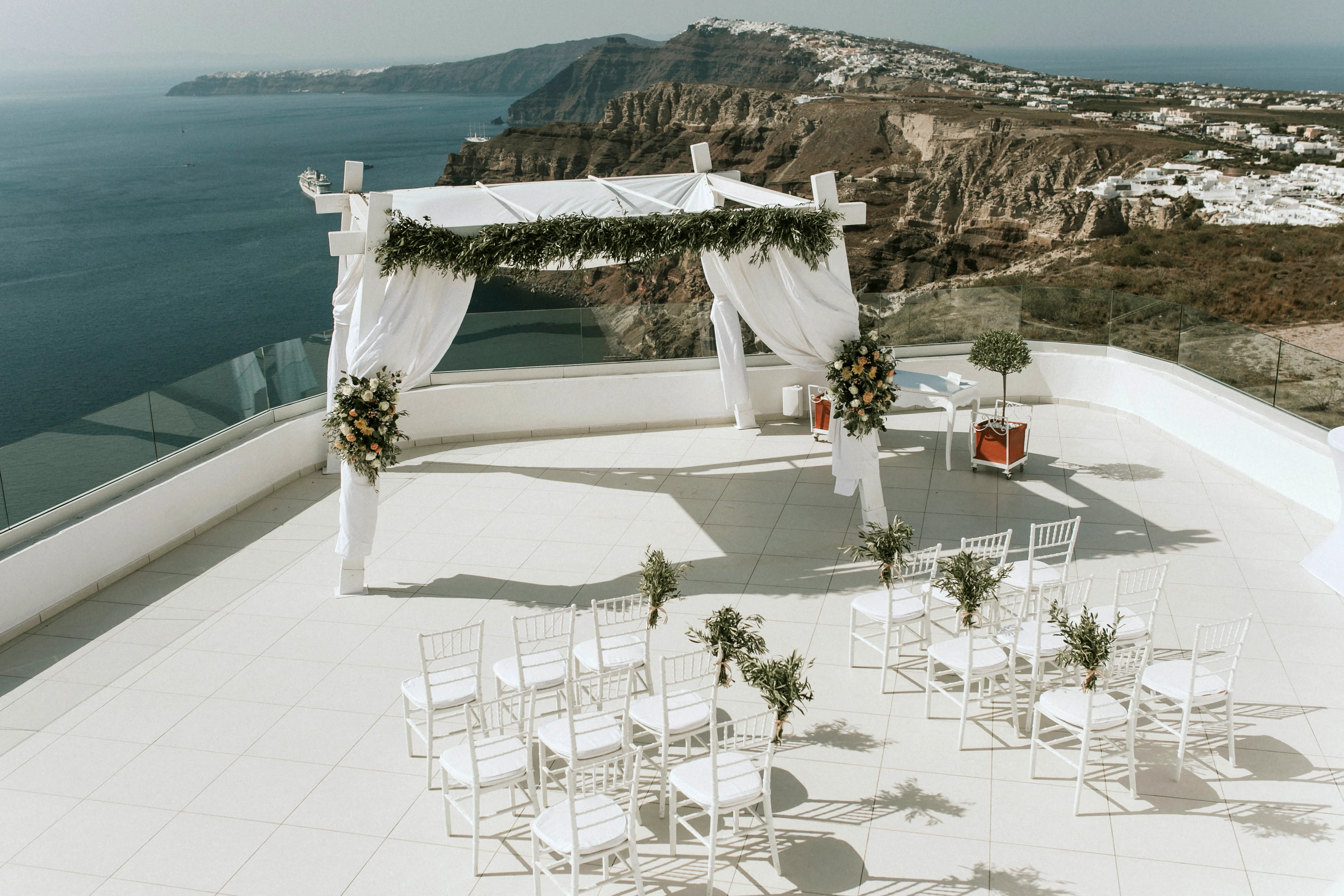 Cliffside wedding ceremony gazebo overlooking the Santorini caldera
