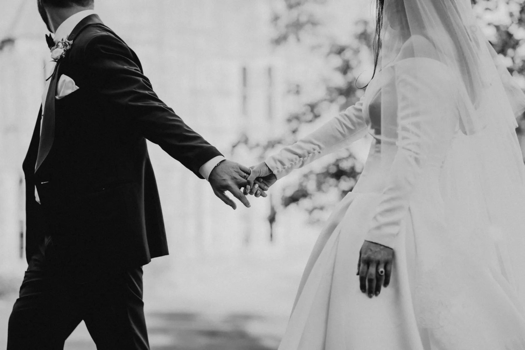 Bride and groom holding hands on their wedding day